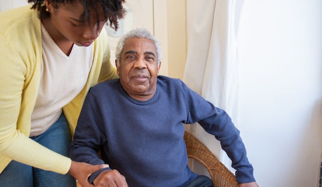 Caregiver helping an elderly man with home care in Calgary