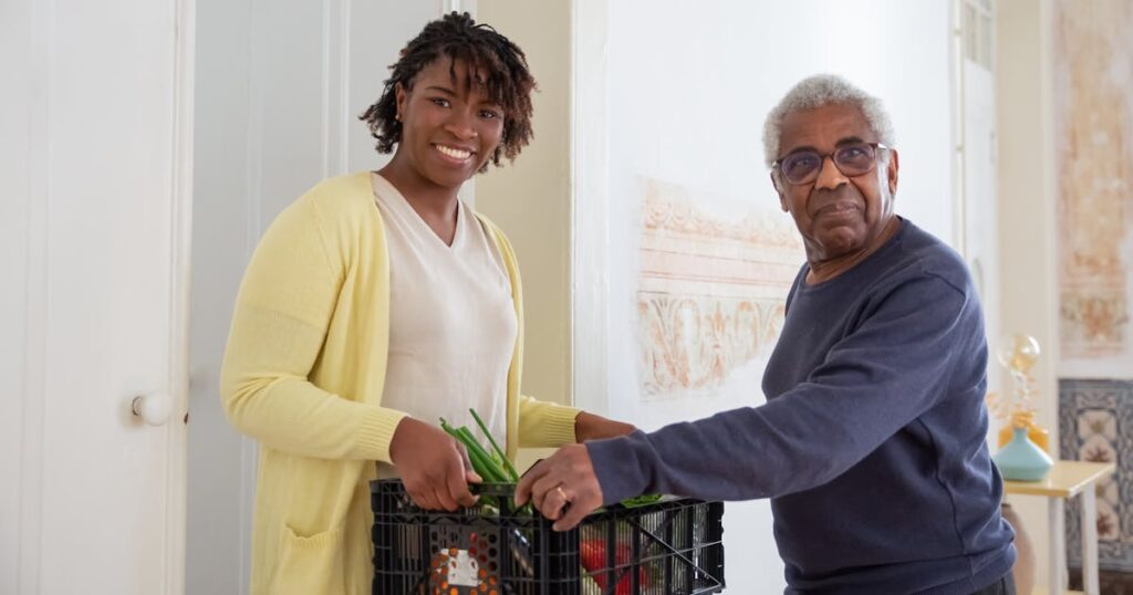 Caregiver helping senior with groceries at a retirement home in Toronto