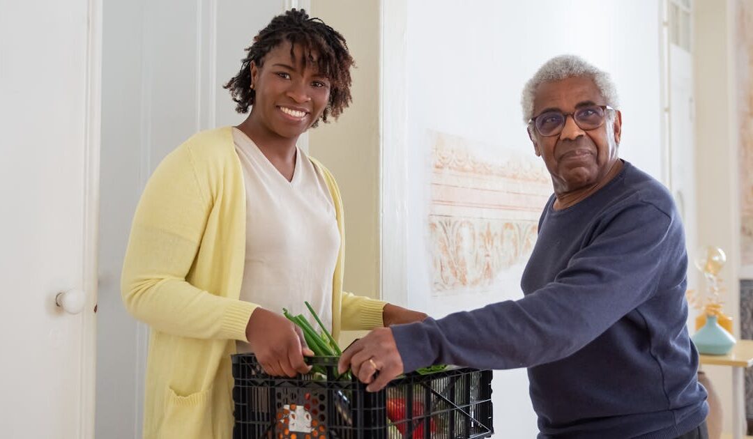 Caregiver helping senior with groceries at a retirement home in Toronto