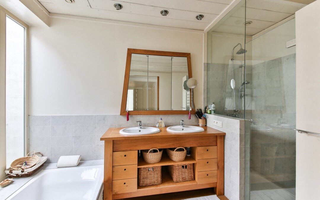 Modern accessible bathroom renovation with walk-in shower and warm wood vanity